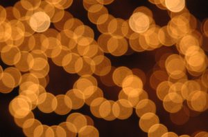 Christmas lights Sparkling and Defocused in yellow with black background